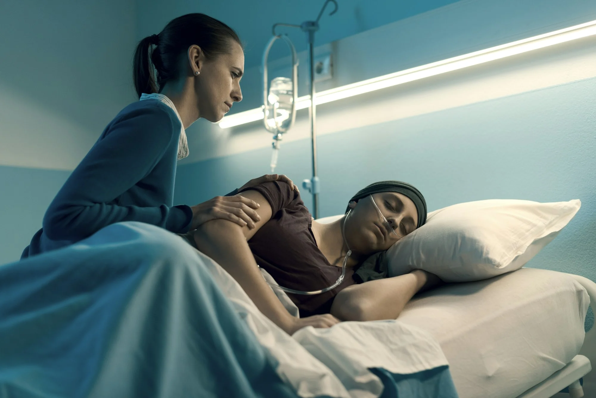 Woman assisting her friend with cancer at the hospital