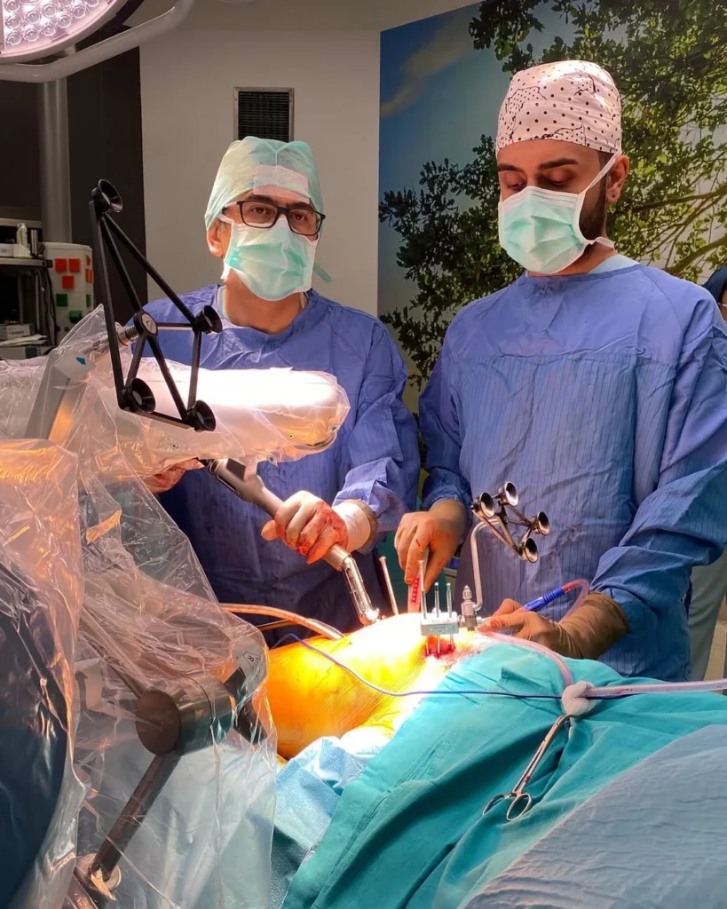  Prof. Mustafa Kurklu while performing a surgery on a patient